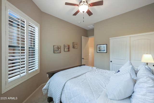 carpeted bedroom with ceiling fan