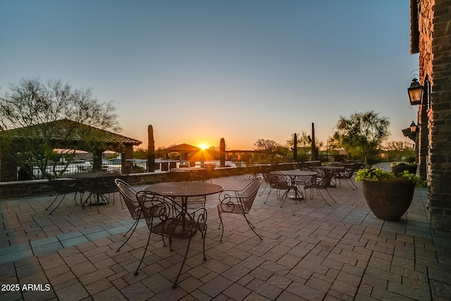 view of patio terrace at dusk