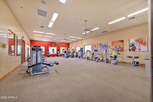 gym featuring light colored carpet and ceiling fan