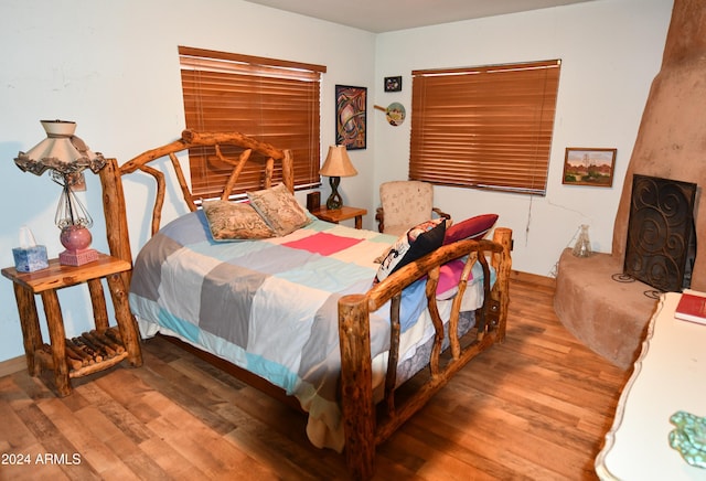 bedroom with hardwood / wood-style floors