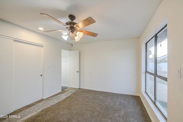 unfurnished bedroom with a ceiling fan, access to outside, carpet floors, and baseboards