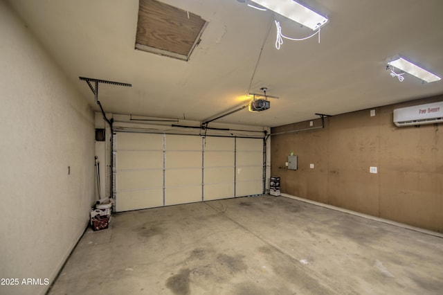 garage with a garage door opener and a wall mounted AC