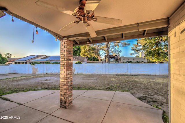 view of patio featuring a fenced backyard and a ceiling fan