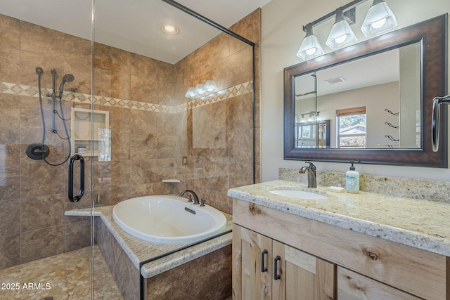 bathroom featuring vanity and plus walk in shower