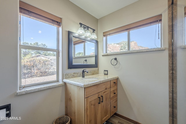 bathroom with plenty of natural light and vanity