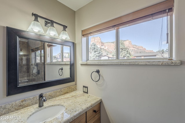 bathroom featuring a mountain view and vanity