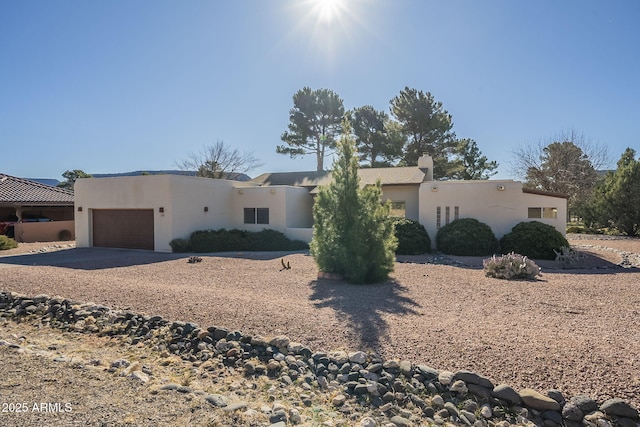 southwest-style home featuring a garage