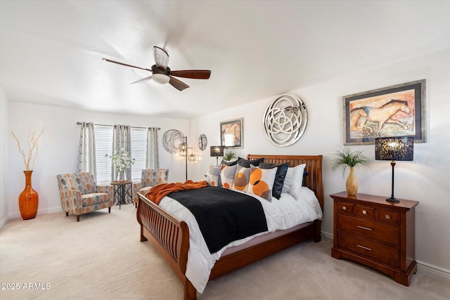 bedroom with baseboards, a ceiling fan, and light colored carpet