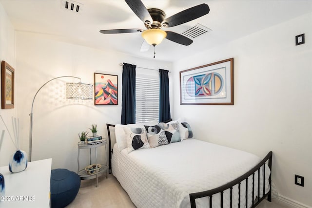 bedroom with light colored carpet, visible vents, and ceiling fan