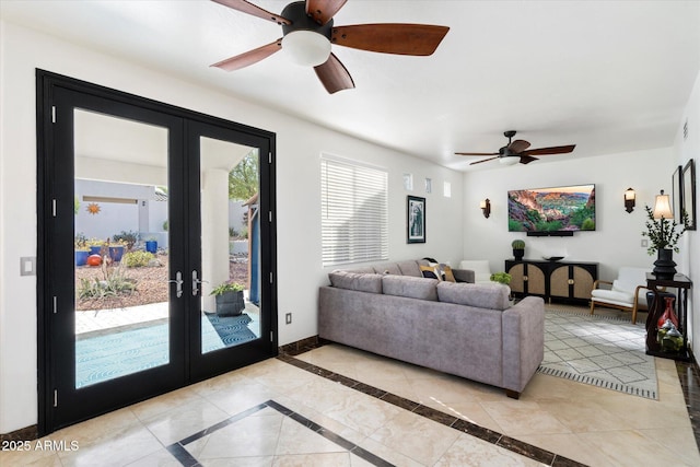 living area featuring french doors and baseboards