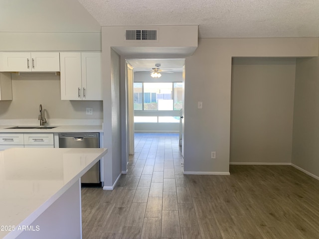2155 W Farmdale Ave Unit 8, Mesa, AZ 85202 - kitchen featuring dishwasher, a sink, a ceiling fan, light countertops, and a textured ceiling