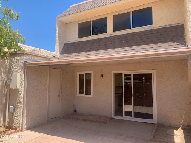 2155 W Farmdale Ave Unit 8, Mesa, AZ 85202 - back of property with roof with shingles, stucco siding, and a patio area