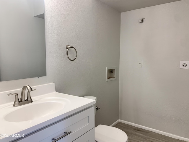 2155 W Farmdale Ave Unit 8, Mesa, AZ 85202 - bathroom featuring toilet, wood finished floors, vanity, and baseboards