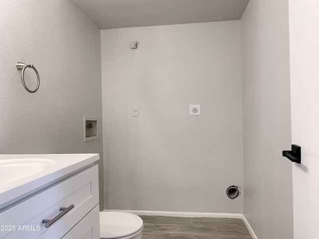 2155 W Farmdale Ave Unit 8, Mesa, AZ 85202 - bathroom featuring wood finished floors, vanity, toilet, and baseboards