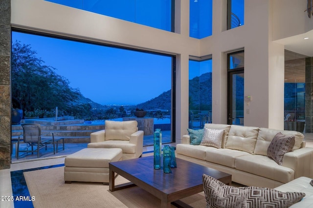 interior space featuring a mountain view and a towering ceiling