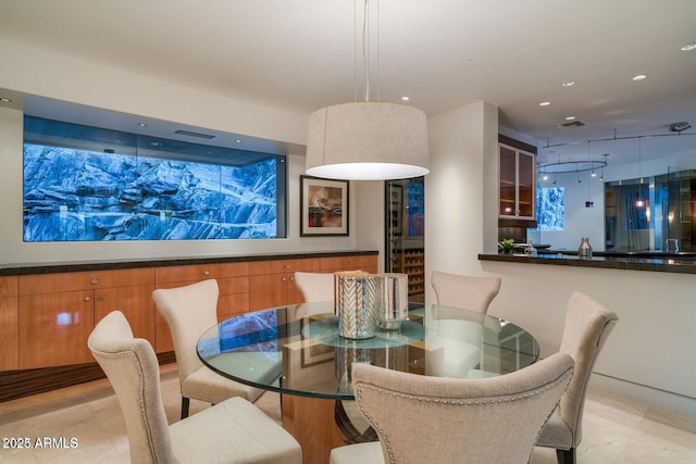 dining space featuring visible vents and recessed lighting