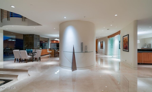 interior space featuring marble finish floor and recessed lighting