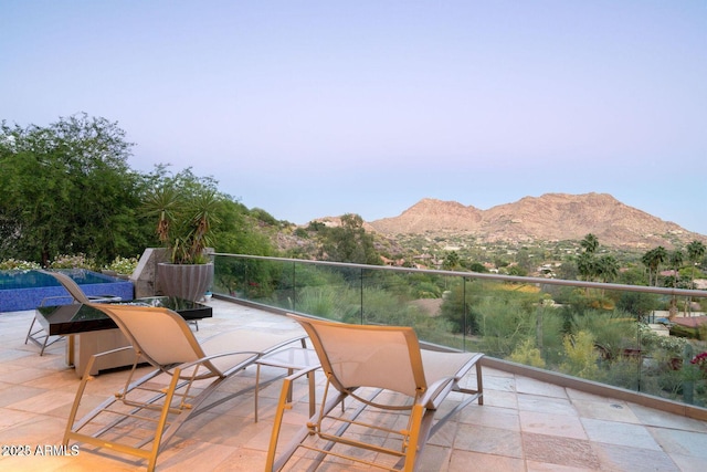 view of patio / terrace featuring a balcony and a mountain view