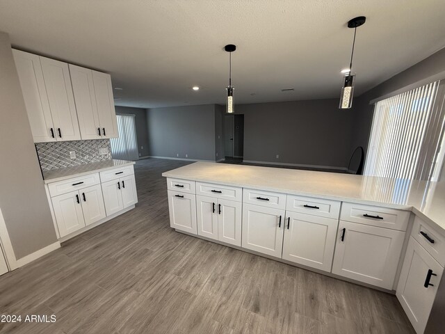 2429 E Alameda Dr, Tempe, AZ 85282 - kitchen with white cabinets, baseboards, light wood-style flooring, and light countertops