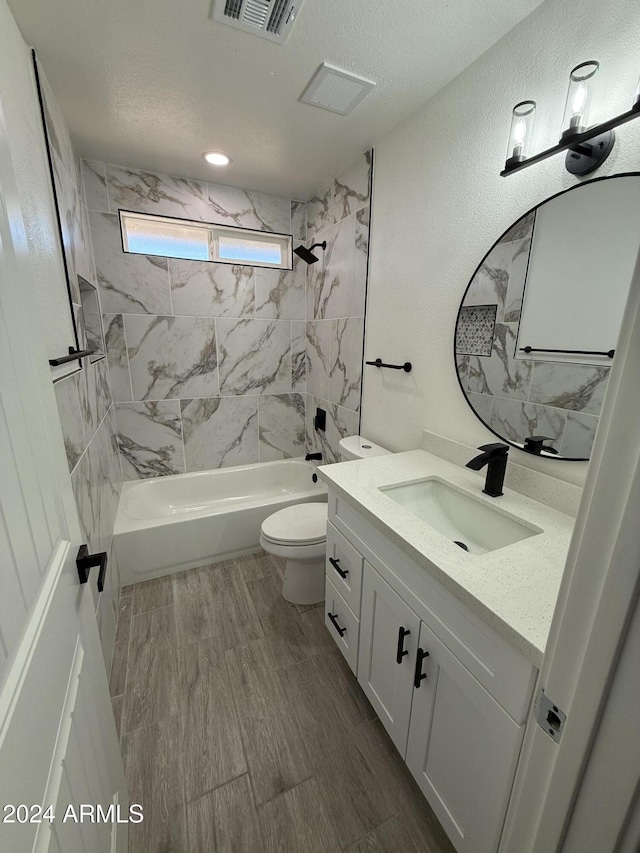 2429 E Alameda Dr, Tempe, AZ 85282 - bathroom with washtub / shower combination, wood finished floors, visible vents, toilet, and vanity