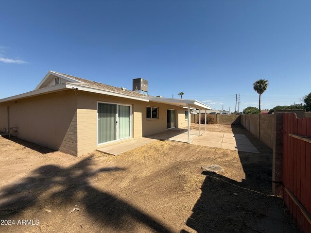 back of house featuring central AC and a patio area