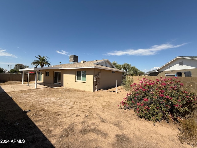 rear view of property featuring a patio