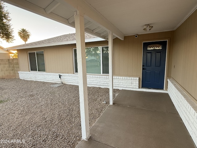 2429 E Alameda Dr, Tempe, AZ 85282 - property entrance featuring brick siding, a shingled roof, and fence