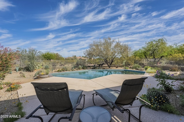 view of pool featuring a patio area, a fenced in pool, and fence