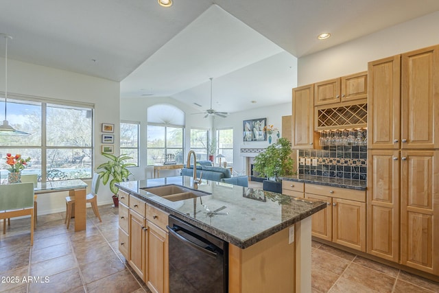 kitchen with a sink, a wealth of natural light, a kitchen island with sink, and black dishwasher