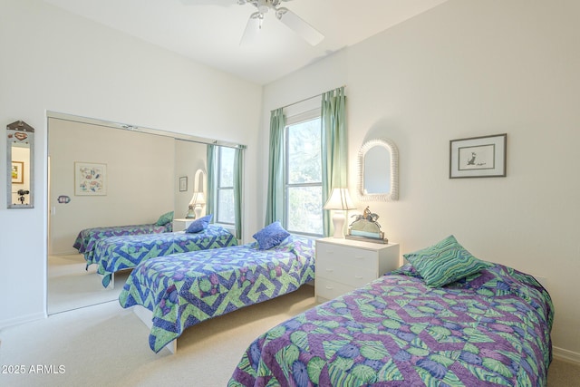 carpeted bedroom with baseboards and a ceiling fan