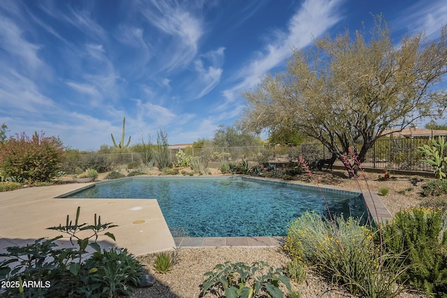 view of swimming pool featuring a patio area, a fenced in pool, and fence