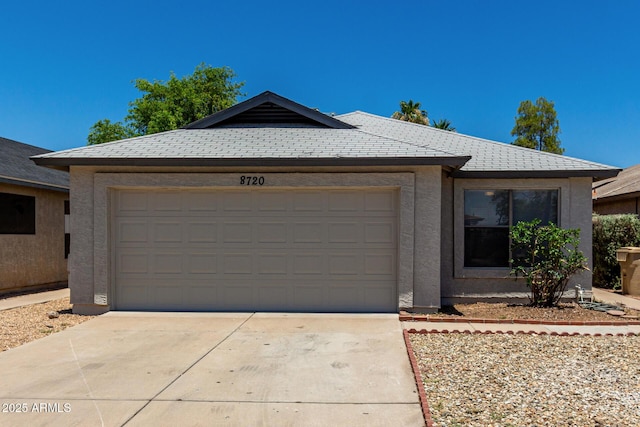 8720 W Willowbrook Dr, Peoria, AZ 85382 - view of front facade featuring an attached garage, driveway, and stucco siding