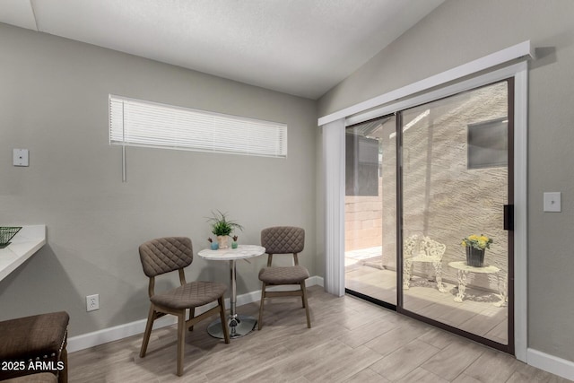 8720 W Willowbrook Dr, Peoria, AZ 85382 - living area featuring light wood-style floors and vaulted ceiling
