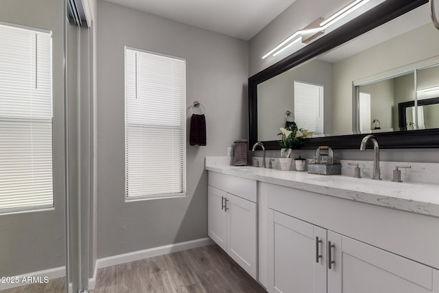 8720 W Willowbrook Dr, Peoria, AZ 85382 - full bathroom featuring double vanity and wood finished floors