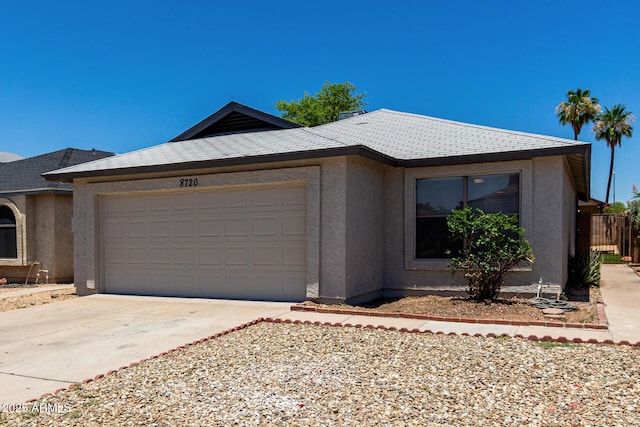 8720 W Willowbrook Dr, Peoria, AZ 85382 - view of front of home with stucco siding, a garage, and concrete driveway