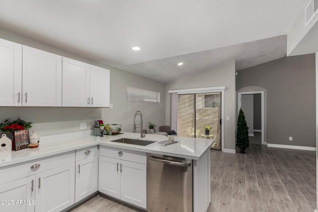 8720 W Willowbrook Dr, Peoria, AZ 85382 - kitchen featuring stainless steel dishwasher, a peninsula, vaulted ceiling, white cabinets, and recessed lighting