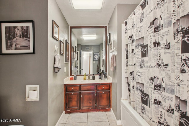 bathroom with tile patterned flooring, visible vents, vanity, and baseboards