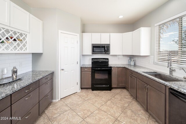 kitchen with white cabinets, appliances with stainless steel finishes, and sink