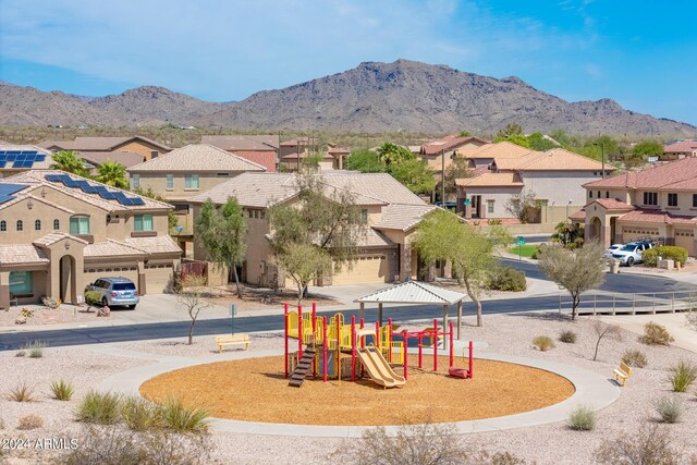 view of playground featuring a mountain view