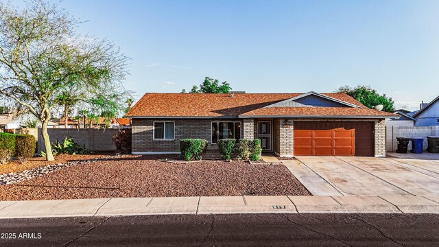 919 W Lodge Dr, Tempe, AZ 85283 - ranch-style house featuring a garage, concrete driveway, fence, and brick siding