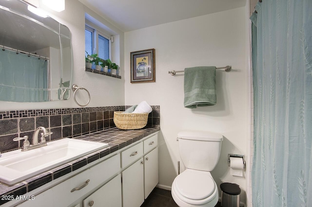 1107 W Osborn Rd Unit 213, Phoenix, AZ 85013 - full bathroom featuring vanity, decorative backsplash, tile patterned flooring, and curtained shower