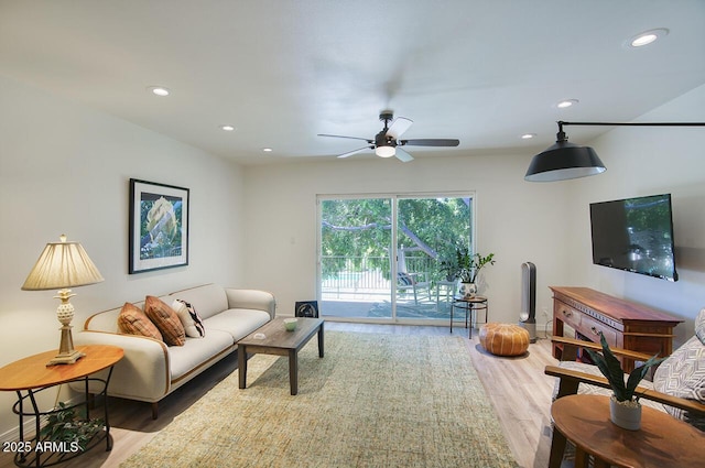 1107 W Osborn Rd Unit 213, Phoenix, AZ 85013 - living area featuring light wood-type flooring, a ceiling fan, and recessed lighting