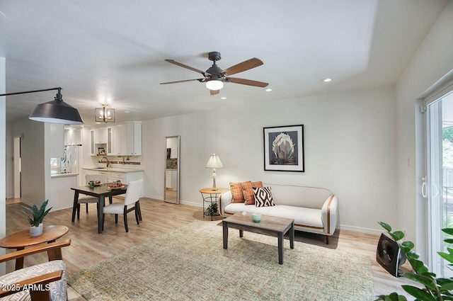 1107 W Osborn Rd Unit 213, Phoenix, AZ 85013 - living area featuring ceiling fan, recessed lighting, and light wood-style flooring