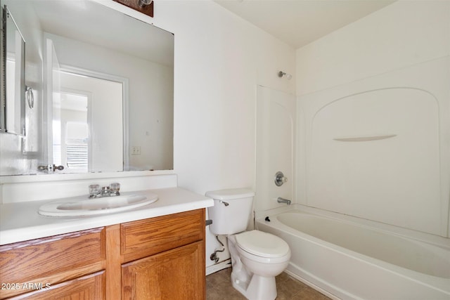 full bathroom featuring toilet, vanity, tile patterned floors, and shower / bathing tub combination