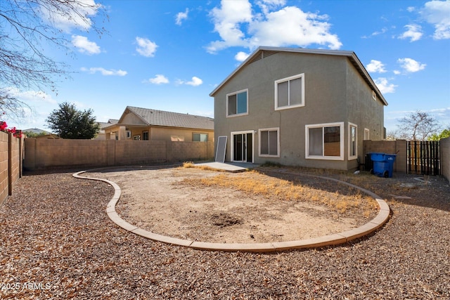 rear view of house featuring a patio