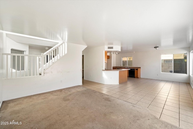 unfurnished living room with light carpet