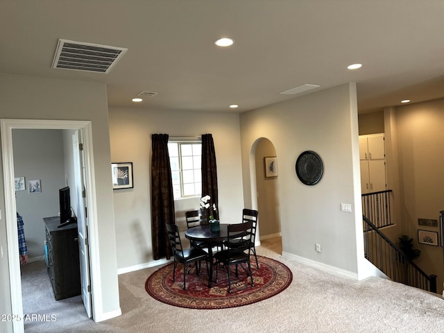 view of carpeted dining space