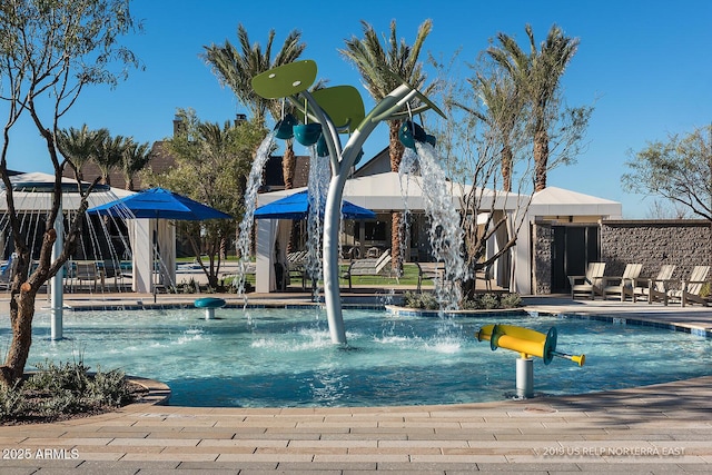 view of pool with pool water feature