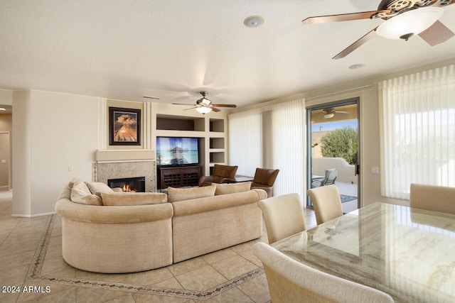 tiled living room featuring a tiled fireplace