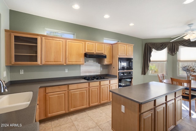 kitchen with ceiling fan, sink, black appliances, and plenty of natural light